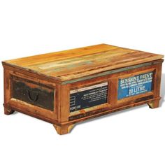 an old wooden box sitting on top of a white surface with blue and black labels