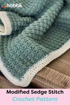 a crocheted blanket sitting on top of a wooden table with text overlay that reads modified sedge stitch yarn yarn design pattern