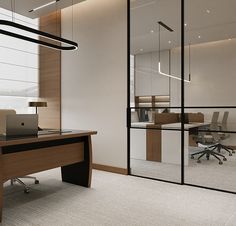 an office with glass walls and desks in front of a large sliding glass door