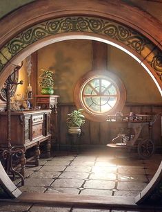 an arched doorway leading into a room with a large window