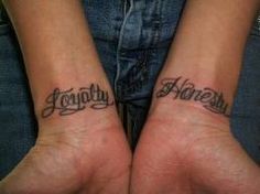 two people with matching tattoos on their arms that say, together we are family and hope