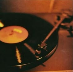 an old record player with a candle on it