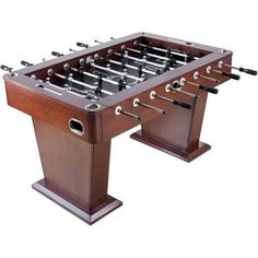 an image of a foosball table that is made out of wood and metal