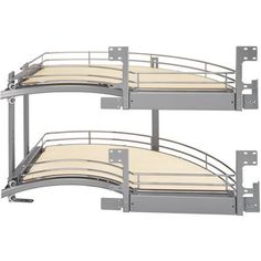 two metal bunk beds sitting next to each other