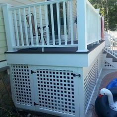 an inflatable pool is on the side of a house next to a deck