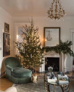 a living room filled with furniture and a christmas tree in the middle of the room