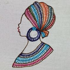 a woman's head with a colorful turban on it