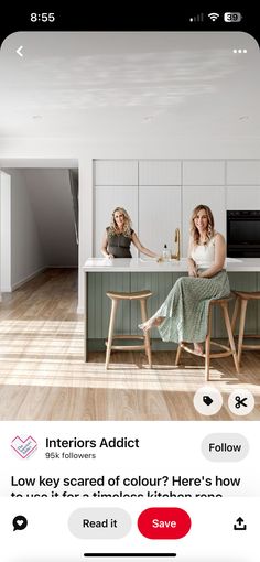 two women sitting at a kitchen counter talking to each other