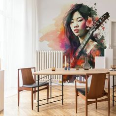 a painting of a woman with a guitar on the wall next to a dining room table