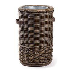 a wicker basket with a candle holder on the top and leather straps around it