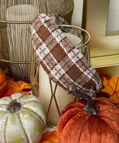 decorative pumpkins and other fall decorations on a table