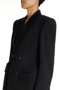 Demna revisits the iconic hourglass shape with this wool-gabardine blazer channeling the exaggerated tailoring of master courtier Cristóbal Balenciaga. Double-breasted button closure Peaked lapels Four-button cuffs Chest welt pocket; front flap pockets 100% wool Dry clean Made in Italy Designer Clothing Wool Tuxedo Blazer With Double-breasted Fastening, Wool Tuxedo Blazer With Double-breasted Button, Black Double Breasted Suit For Evening, Black Double Breasted Suit With Double Button For Evening, Designer Black Blazer With Pressed Crease, Luxury Black Blazer Dress With Double-breasted Button, Luxury Black Blazer Dress With Double Button, Luxury Black Blazer Dress With Double Button Closure, Double-breasted Wool Tuxedo For Work