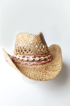 Did someone say coastal cowgirl summer??? Beach day? Country concert? Girls trip? Our handmade cowgirl hats are the PERFECT accessory for any outfit! The Kaipo (or Sweetheart) Hat is a tan straw cowgirl hat decorated with pink & gold ribbon, plain cowrie shells, & gold chain. Coastal Cowboy Party, Beach Cowgirl Hat, Coastal Cowboy Hat, Camp Crush, Coastal Cowgirl Hat, Beach Cowboy Hat, Coastal Cowgirl Outfit, Beach Cowboy, Cowgirl Halloween Costume