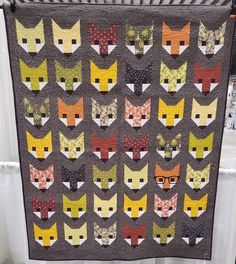 a quilt made to look like many cats