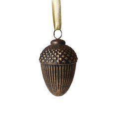 an antique looking vase hanging from a string