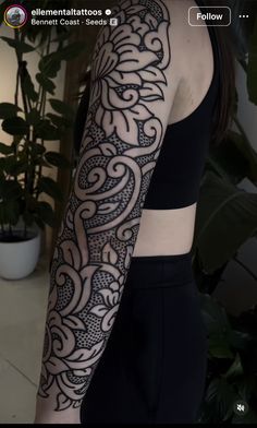 a woman's arm with an intricate tattoo design on the left side of her body