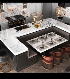 a kitchen with marble counter tops and gold accents