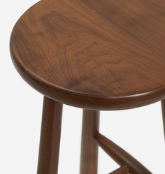 a close up of a wooden stool on a white background with no people around it