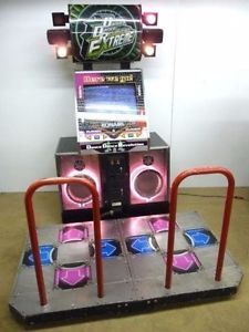 an arcade machine sitting on top of a metal platform