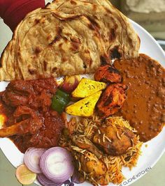 a white plate topped with different types of food