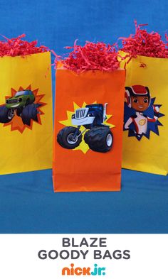 three paper bags decorated with monster trucks