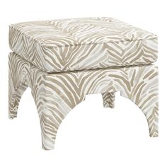 a zebra print foot stool sitting on top of a white floor