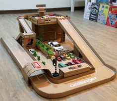 a toy car race track with cars on it