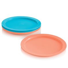 two orange and blue plates sitting next to each other