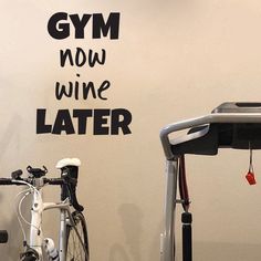 there is a gym room with a wall decal that says gym now wine later