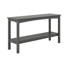 a gray bench sitting on top of a wooden table