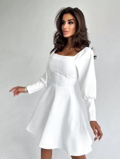 Elegant White Dress with Puff Sleeves and Square Neckline - Perfect for Special Occasions! Make a statement with this stunning white dress featuring a chic square neckline and elegant puff sleeves. Crafted from premium materials, this dress offers both comfort and style, making it ideal for weddings, parties, and other special occasions. The timeless A-line silhouette and flattering fit ensure you'll feel confident and beautiful wherever you go.     Features:     Material: Soft, high-quality fabric for comfort and durability     Design: Square neckline with voluminous puff sleeves for a fashion-forward look     Fit: A-line shape, tailored to accentuate your waist     Occasion: Perfect for formal events, bridal showers, date nights, or a night out     Color: Classic white for a timeless, el Elegant White Dress, Dress With Puff Sleeves, Design Square, Square Necklines, Bridal Showers, Feel Confident, Classic White, Square Neckline, Puff Sleeves