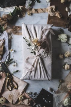 a wrapped gift with flowers on it