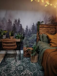 a bed room with a neatly made bed and a wallpapered forest scene behind it