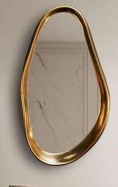 a mirror that is on the side of a wall