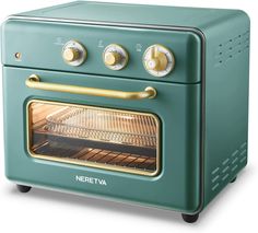 the oven is green and has two burners on each side with gold knobs