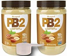 two jars of peanut butter sitting next to each other on a white surface with the words pb2 written in it