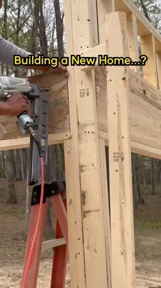 a man working on a wooden structure with the words, building a new home?