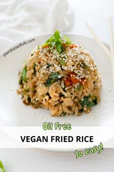 a plate of vegan oil free fried rice with chopsticks on the side with text "oil free vegan fried rice so easy!"