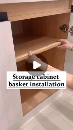 a person is opening the cabinet door to install an appliance in a bathroom