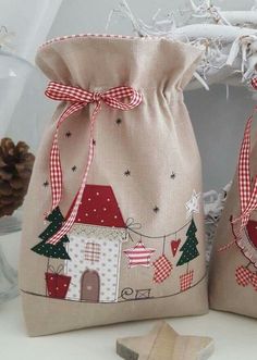 two small bags with christmas decorations on them