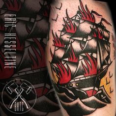 a black and red ship with flames on it's side tattoo by the ink studio