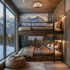 a bedroom with bunk beds in front of a mountain scene wallpapered on the walls