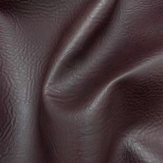 the texture of leather is very dark brown