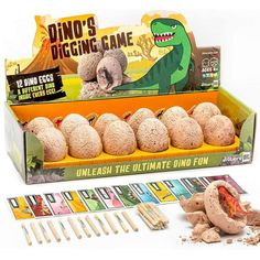 the dino's digging game is in its box and ready to be played with