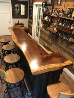 an empty bar with stools in front of it