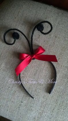 a close up of a red ribbon on a headband