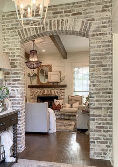 a living room filled with furniture and a fire place