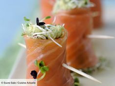 several small rolls filled with vegetables and sprouts