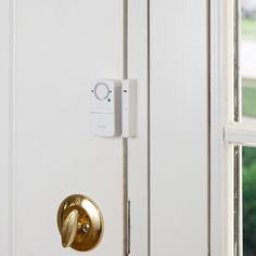 an electronic door lock on a white door