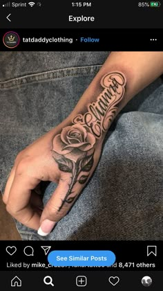 a person's hand with a rose and the word grandma tattooed on it in cursive writing